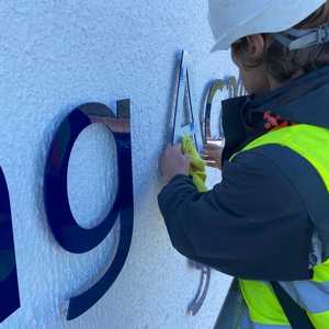 Applying the large 45mm letters with care and accuracy