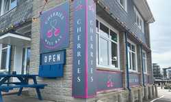 Signage and Sunshine for Cherries in West Bay Signage and Sunshine for Cherries in West Bay