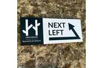 wall mounted onto brick wayfinding branded signage.jpg