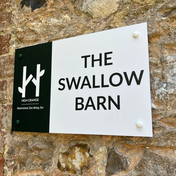 ACM printed wall mounted panel on brick wall