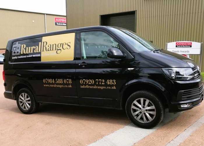 Gold & Black Vehicle Graphics applied to black works vehicle van