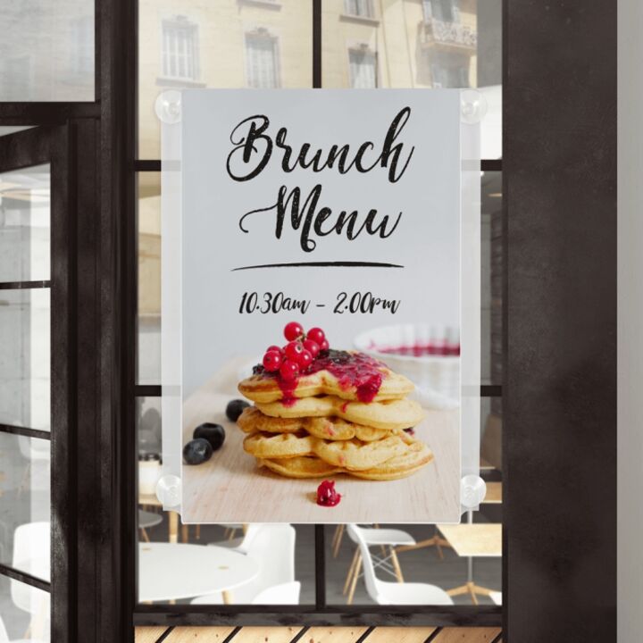 Window Display Poster Holder on window with suction cups.png